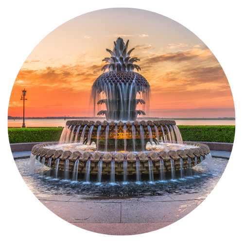 Charleston's iconic pineapple fountain at waterfront park during sunrise, symbolizing hospitality and the city’s vibrant culture